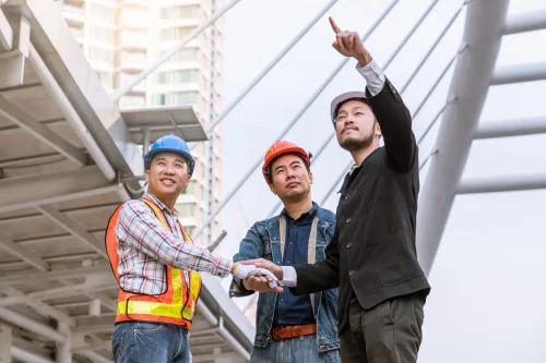 manager meeting with engineer outdoor site stack hand teamwork scaled.jpg 1500x1000 1